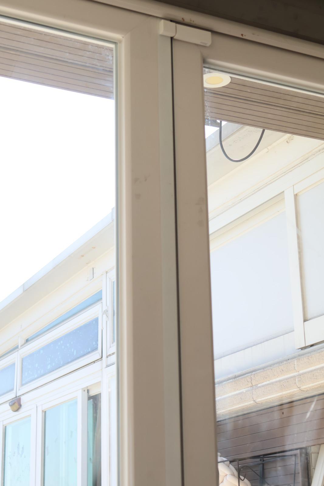 Full-height real photograph of a finished door frame used to assess installation access